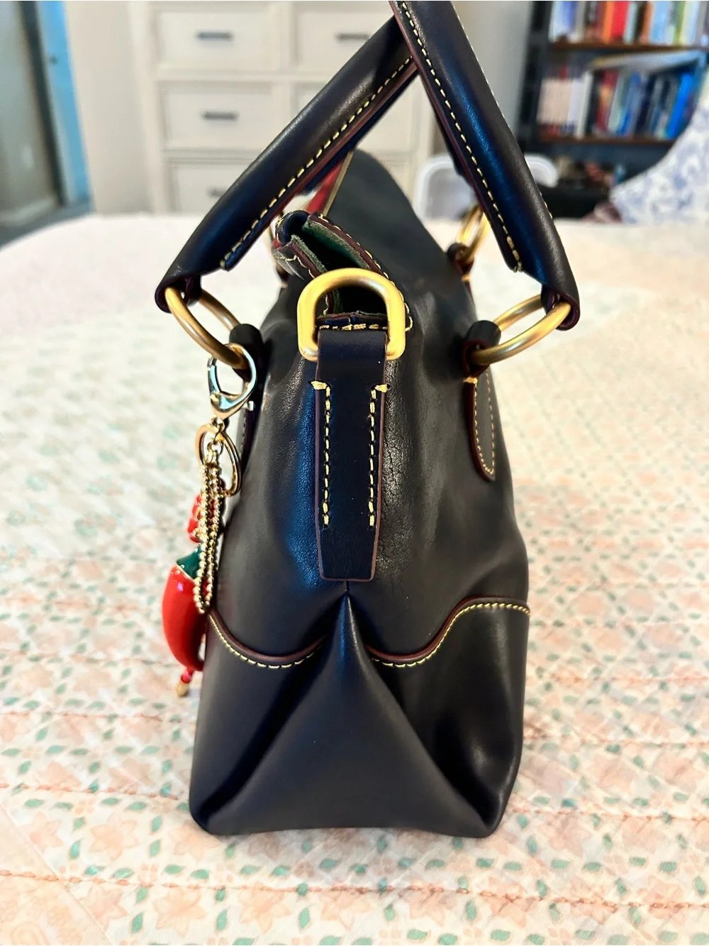 Dooney and Bourke Florentine Satchel 30 in the color Navy. EUC comes w/bag charm